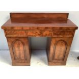 A 19th century flamed mahogany twin-pedestal sideboard of small proportions, with three central