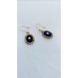 A pair of 15ct gold oval shaped drop earrings, set with seed pearls and blue enamel, on 9ct gold