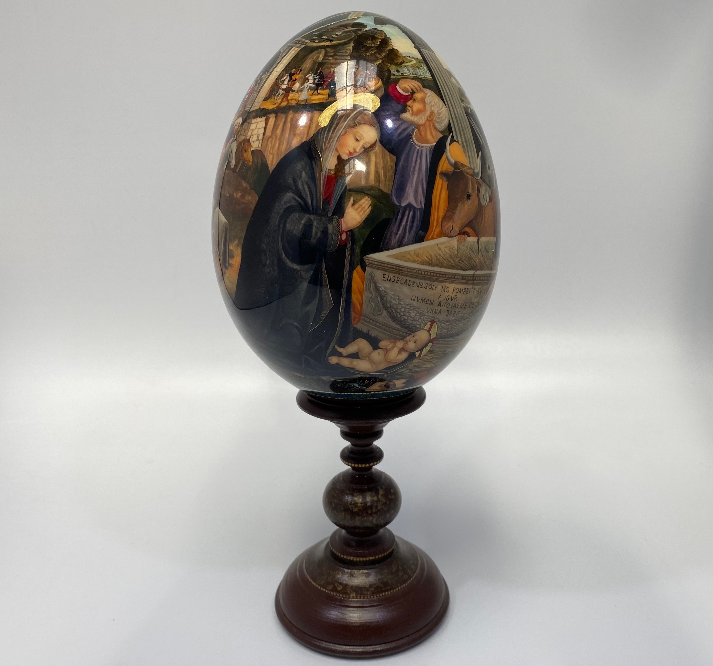 A St Petersburg hand-painted and laquered papier-mache egg depicting the Adoration of the Magi,