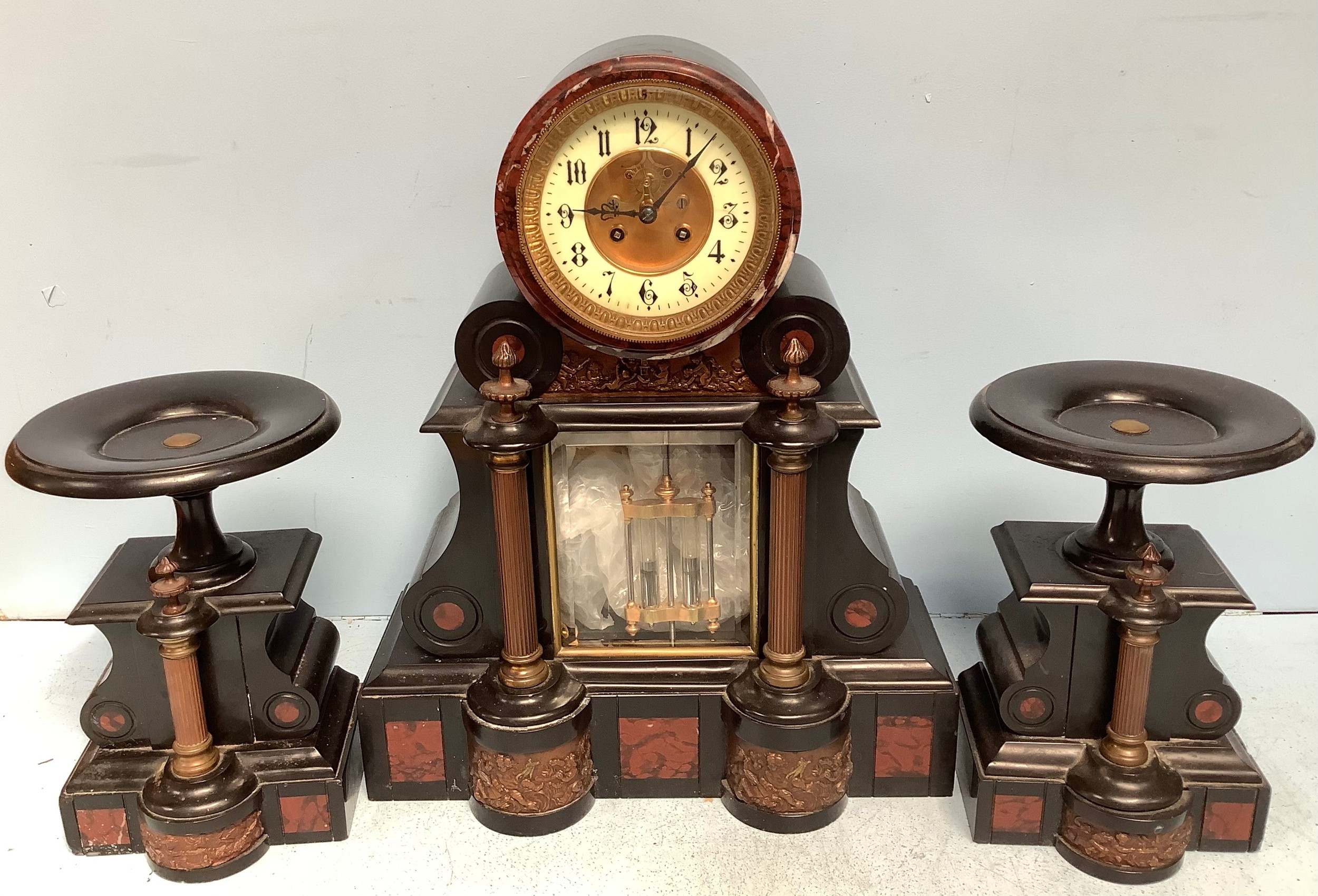 A 19th century French black slate rouge marble and gilt metal mounted three piece clock garniture,