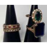 A 9ct gold dress ring claw-set a large emerald cut blue stone, together with a 9ct eternity ring,