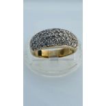 A 9ct yellow gold dress ring, pave set with small round diamonds, estimated total weight of diamonds