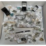 Approximately 100 pieces of costume jewellery including earrings, necklaces, bracelets and a watch