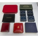 Ten assorted proof coin boxes, some multi-coin boxes etc.