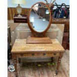 An Edwardian satinwood dressing table with a pair of inlaid drawers with brass 'gothic revival'
