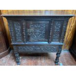 A 19th century continental profusely carved and stained oak cabinet in the renaissance revival