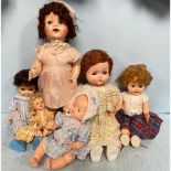 Ten various 1950s dolls including a large Pedigree ‘crying’ baby doll with cinderella shoes, 70cm