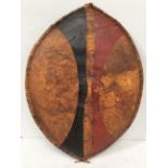 An early 20th century Maasai shield, Kenya hide with painted with red ochre and black geometric