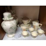 A Burleigh ware floral, green and gold banded art deco part tea and coffee service comprising