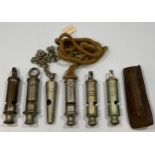Six various whistles including 'Portsmouth Police' and 5x Metropolitans, one leather pouch (6)