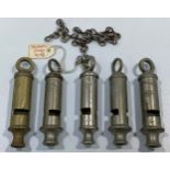 Five various whistles including a WW1 Huddson No.1 dated 1917 with broad arrow, ACME City, ARP and