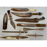 Seven various daggers and sheaths including a Persian style curved dagger, together with a silver