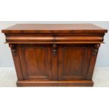 A 19th century mahogany chiffonier with pair of pulvinated drawers above pair of arched cupboard