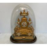 A 19th century French gilt-metal and porcelain mantel clock, the round turquoise enamel dial with