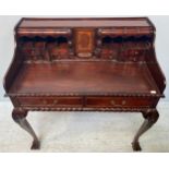 A reproduction stained teak bureau with serpentine shaped drawers, secret compartments, gadrooned