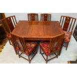 A Chinese rosewood extending dining table, in a faux bamboo design, together with a set of six