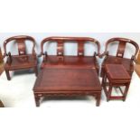 A five-piece Oriental hardwood suite comprising a three-seater sofa (af), rectangular coffee