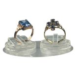 Two yellow gold rings, set with blue stones, weighing a total of 4.4 grams.