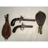 A 19th century double-barrel percussion lock pistol and single-barrel percussion lock pistol,