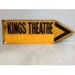 An enamel sign shaped as an arrow and reading ‘To Kings Theatre’, finished in yellow and black,