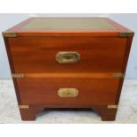 A two-drawer brass bound campaign style chest with green gilt-tooled leather top, twin side brass