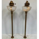 A pair of Victorian brass-mounted ship's glass paraffin lamp glass reservoirs with adjustable wick