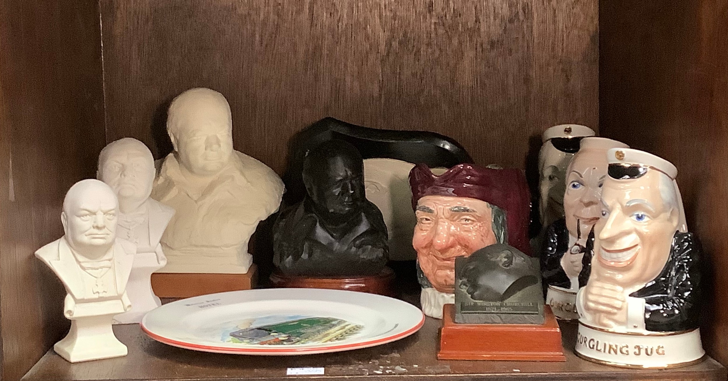Five various busts of Winston Churchill together with a plaster plaque of Churchill, three various