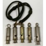 Five various whistles including ARP by Huddson, City police or Fire Whistle, The Scout Master,
