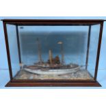 A painted wooden waterline model of an early 20th century single screw steam yacht, in glazed wooden