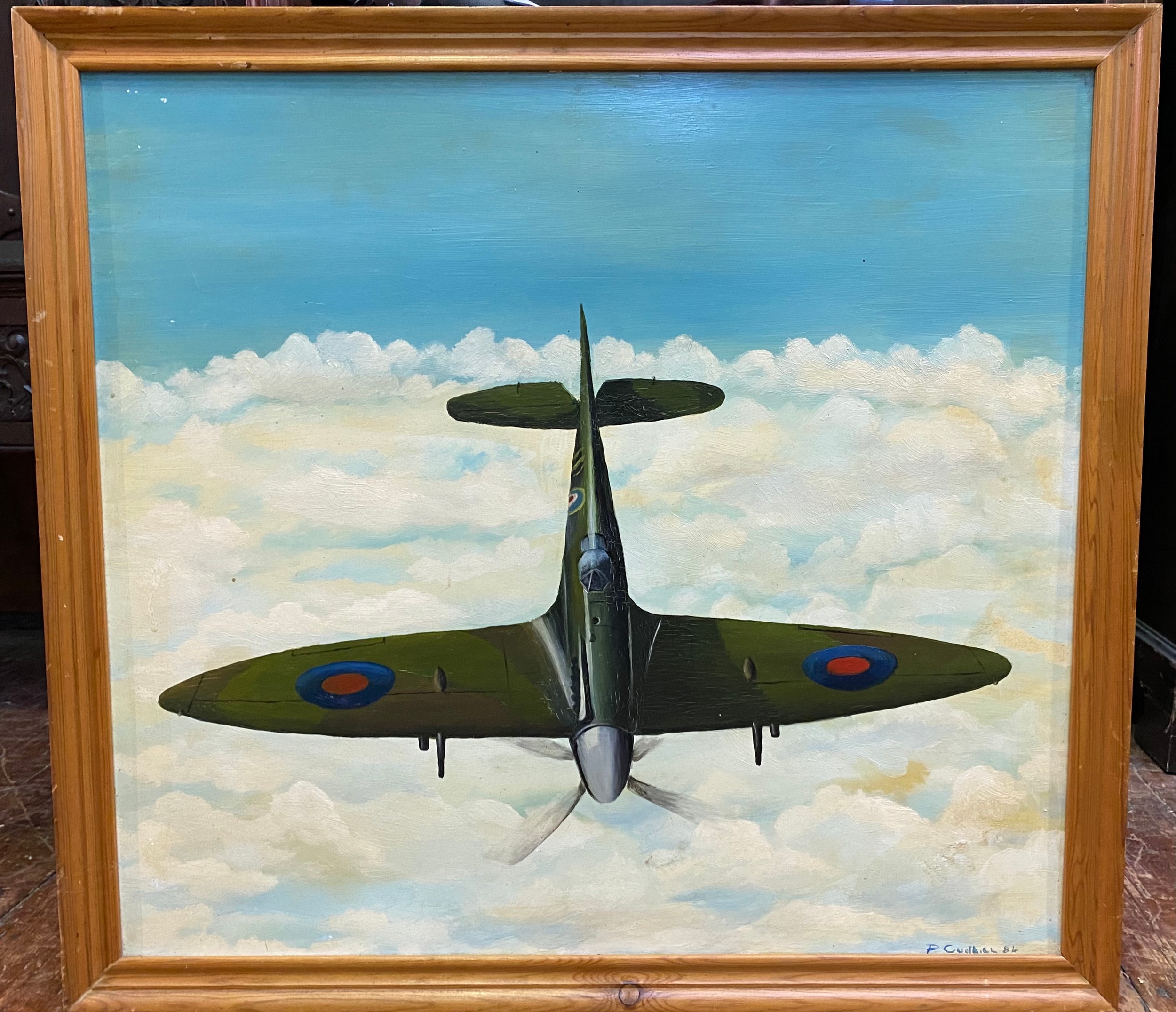 P. Cudbill /D. Cudbill. RAF Spitfire above the clouds, signed, oil on board, 62x68cm