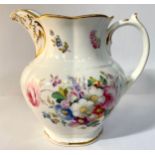 A 19th century porcelain jug, painted with flowers and with a gilt monogram 'VR', 19cm high,