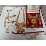 An Indian 22ct gold-plated demi-parure jewellery set, with red and white stones, in retailers box,