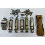 Six various whistles including LCC, a 1915 dated example with chain and button hook, ACME