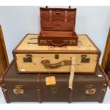 Three various vintage suitcases / trunks including a brown trunk with Cheney locks, 90cm wide and