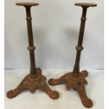 A pair of Victorian cast iron table tripod bases (lacking tops)