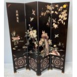 A Chinese four-fold dressing screen in black lacquer decorated with birds and flowers, 185 x 160cm