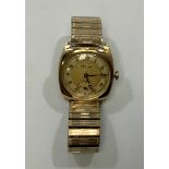 A vintage 9ct gold cushion cased manual wind Vertex wristwatch, the gilt dial with off white chapter