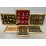 Six framed sets of Soviet military medals and badges (6)