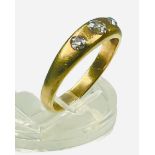 An 18ct yellow gold dress ring, set with three old-cut diamonds, estimated total weight 0.20cts,