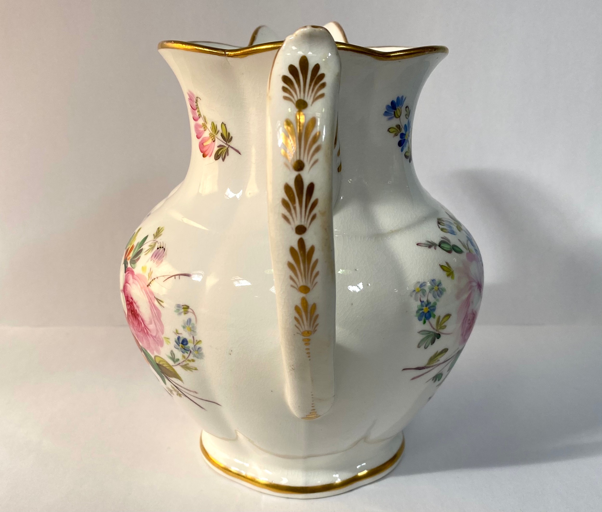 A 19th century porcelain jug, painted with flowers and with a gilt monogram 'VR', 19cm high, - Image 4 of 6