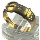 A 15ct yellow gold buckle ring, set with two eight-cut diamonds, ring weighs 3.0 grams, finger