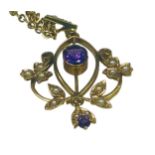 A 9ct yellow gold pendant set with an oval amethyst to the centre, with seed pearls set to the