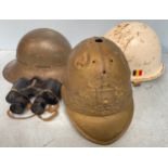 A WWII Zuckerman Home Defence helmet marked ‘AMC 5 1941’, together with a white painted M1 helmet