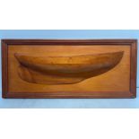 A stained and varnished wooden half-block model of a yacht hull, mounted on wooden plinth with