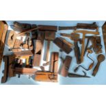 A quantity of shipwrights wooden moulding planes, smoothing planes, braces and fret saws etc, in two