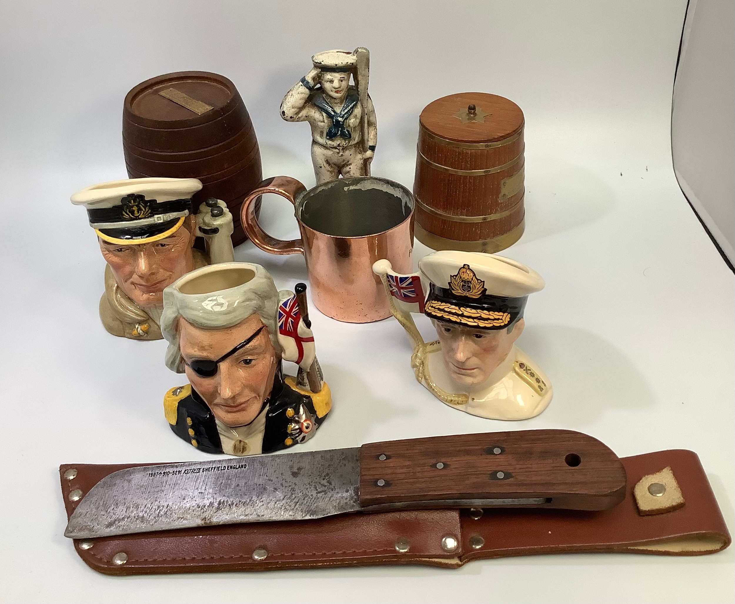 A Royal Navy rigging knife and sheath, together with a copper 1/2 pint rum measure, Royal Doulton