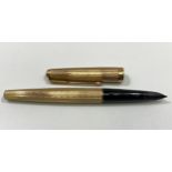 A 9ct gold Parker pen with engine turned decoration, engraved ‘M McD’ marked ‘375’, lid marked ‘