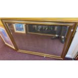 A large rectangular bevelled mirror in gilt frame, 135 x 104