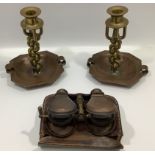 A pair of interesting trench art candlesticks, the stems intertwined brass (marked made in