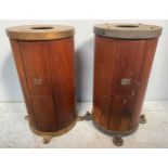 Two early 20th century ships binnacle compass stands, of cylindrical form with teak panel with metal